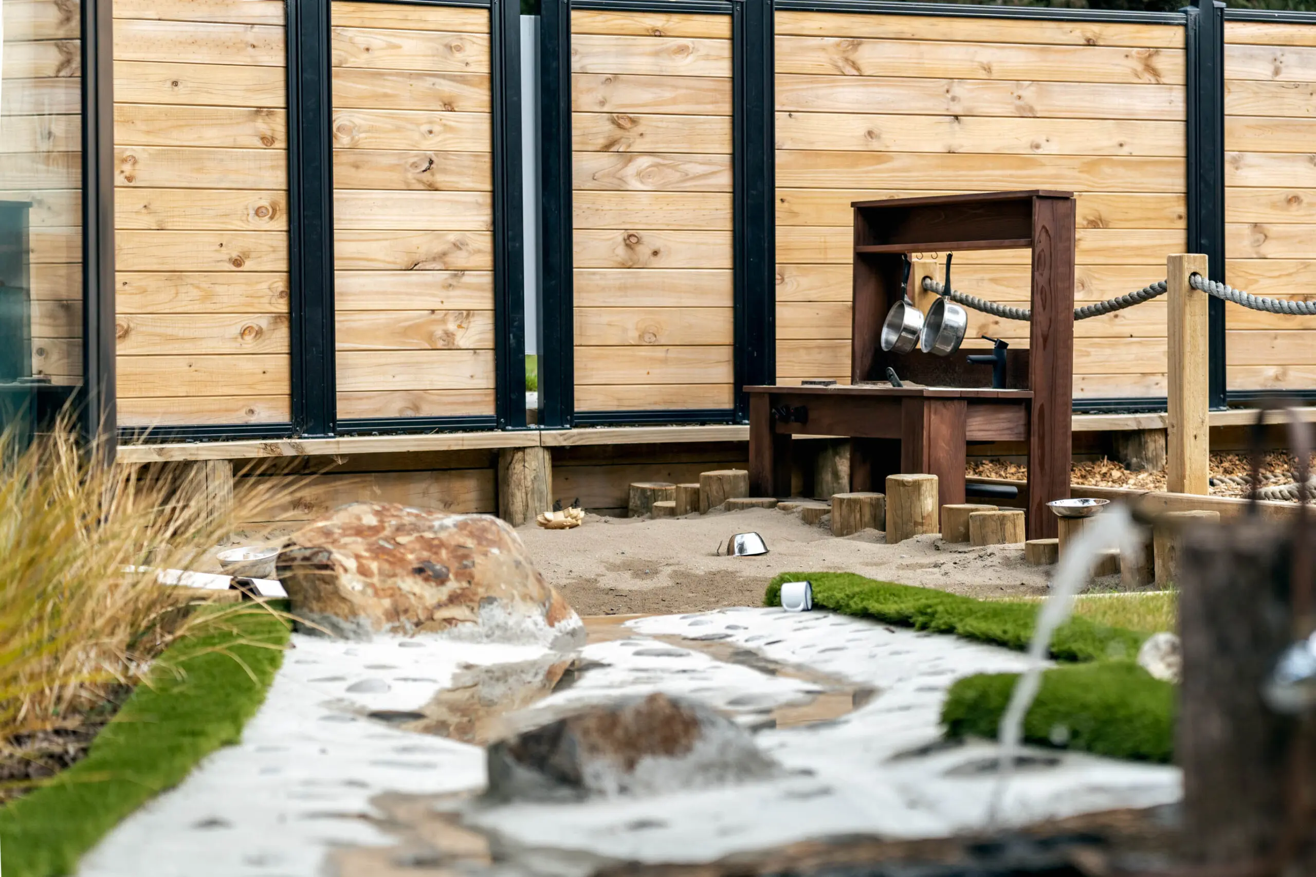 The outdoor sand pit and natural play area