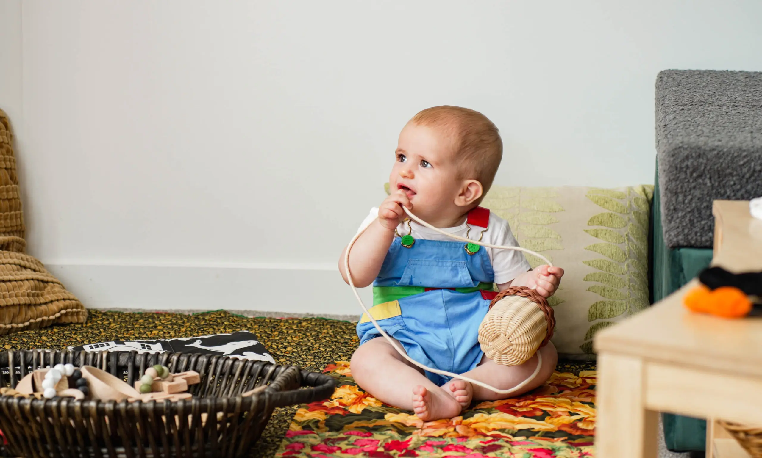 A young child enjoying kai at the little table